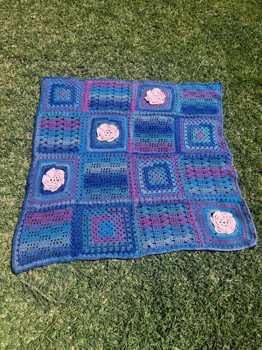 Granny Square Crochet Blanket with Pink Flower Accents – Handmade by Lyndsay