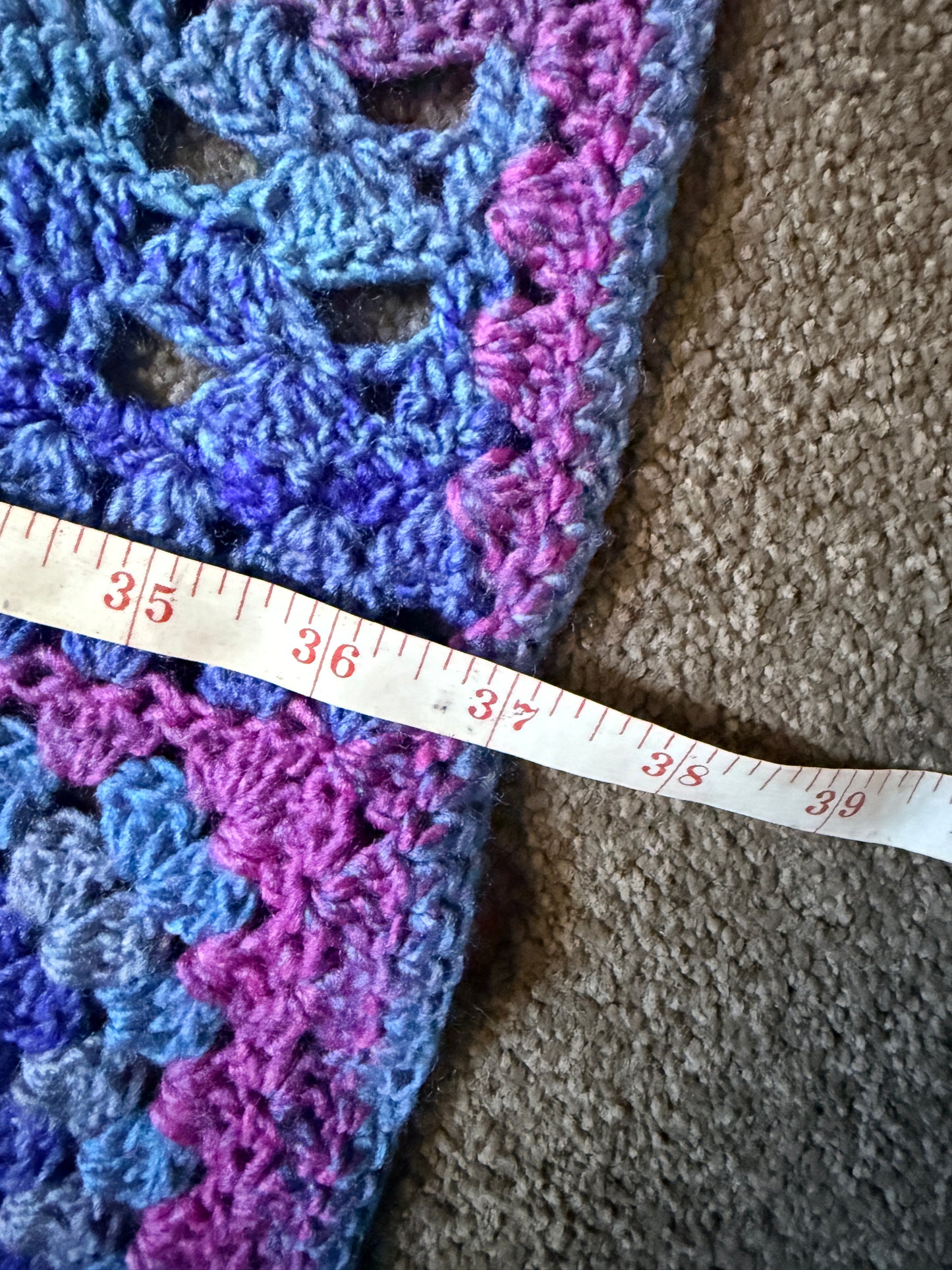 Granny Square Crochet Blanket with Pink Flower Accents – Handmade by Lyndsay