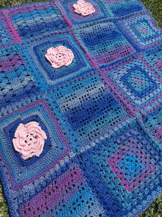Granny Square Crochet Blanket with Pink Flower Accents – Handmade by Lyndsay